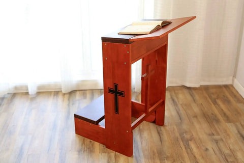Folding Wooden Prayer Kneeler Bench For Home Or Church Space Saving Kneeler With Fold Up Tabletop And Bible Shelf Sturdy Kneeling Furniture 20 By 25 By 32 Inches, side view showing cross accents and open Bible