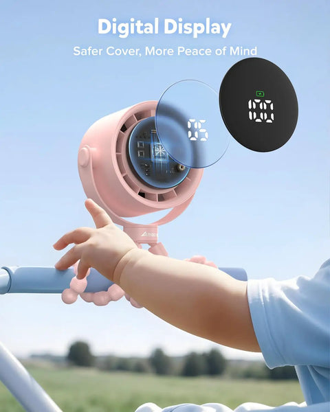 Baby's hand reaching for Rechargeable Clip On Baby Stroller Fan With Five Speeds, LED Display, 360 Degree Pivot on stroller handle.