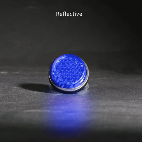 Deep Blue Reflector Motorcycle License Plate Bolts And Nuts Set for Bikes Cars Trailers Boats, single reflector close-up on dark surface