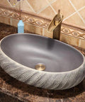 USZWBY Vessel Sinks Bathroom Vessel Sink Washbasin Ceramic Art Countertop Basin round sink with textured edges on a marble countertop.