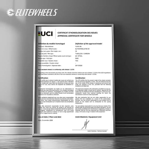 Approval certificate for gravel carbon wheelset with ceramic bearings and disc brakes displayed in a frame on wall