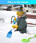 Child playing in snow with 16 Inch Kids Beach Shovel Set 3 Pack With Solid Wood Handles ABS Plastic Digging Spades Rakes And Scoops