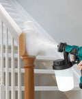 Cordless Paint Sprayer With 3 Spray Patterns And Adjustable Knob, Battery Powered For Quick Home Projects, 900ml Tank in use on stair railing