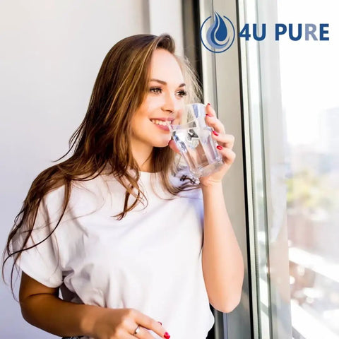 Woman drinking water by window, promoting Water Filter Replacement Pack Of 3 For Frigidaire PureSource Ultra II EWF02 Systems