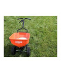 Front view of orange lawn spreader, not 60 Lb Heavy Duty Spreader Workhorse For Lawn And Garden Use With Durable Black Finish