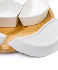 Close-up of Ceramic Rotating Serving Tray With Six Removable Compartments Lazy Susan Style showing ceramic bowls and bamboo base
