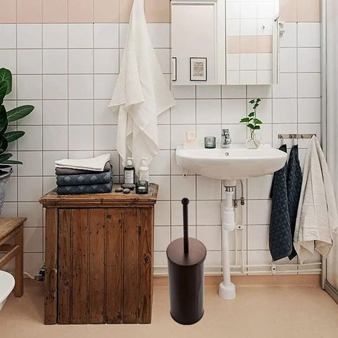 Bathroom with Heavy Duty Bronze Toilet Plunger With Metal Canister Holder And Drip Cup beside a sink