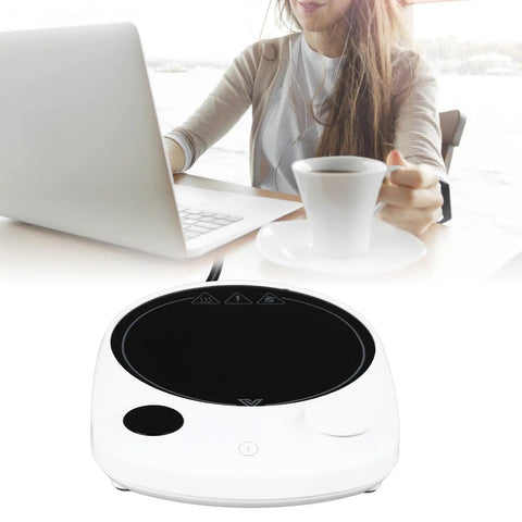 This Solid Electric Mug Warmer Boasts Four Heat Presets To Keep Your Daily Brew Piping Hot All Day Long Featuring Smart Auto Shut Off Protection And Fast Heating With A Sleek White Top For Desk Setup, with a woman and laptop.