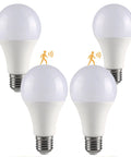 Four Pack Motion Sensor LED Bulbs 12W, 100W Equivalent A19 E26 Dusk To Dawn Indoor Outdoor Use, 5000K Daylight, 1200 Lumens, Glass-Penetrating Sensor, Upward Or Downward Mount, Easy Install, four LED bulbs on white background