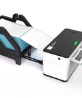 Heavy Duty Pro Grade Label Holder For Rolls And Fan Fold Labels Compatible With Most Desktop Thermal Printers Keeps Shipping Labels Secure On Roll Or Fan Fold Paper Black Finish For Industrial Office Use, shown with thermal printer and fan-fold labels.