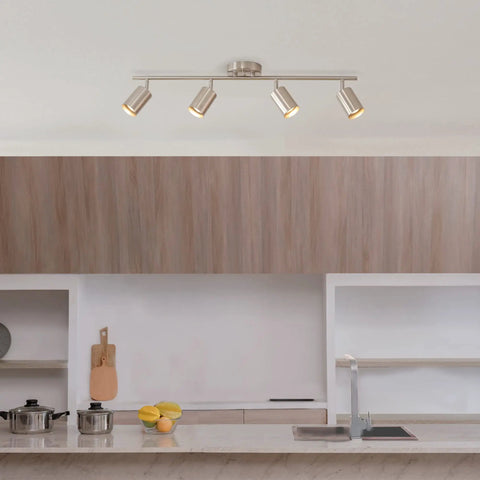 Pratt 4 Light Track Lighting Fixture in Brushed Nickel With Pivoting Heads above modern kitchen island