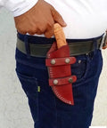 Person wearing Top Grain Leather Knife Sheath For Fixed Blade Knives Belt Carry Dual Orientation Vertical And Horizontal Left Hand Friendly Handcrafted Holster For 5 Inch Blades Up To 1.5 Inch Wide Durable Everyday Carry Ready.