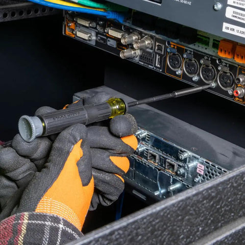 Using the 64 Piece Micro Ratchet Bit Set With Low Profile Magnetic Driver on electronic equipment for repairs.