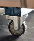 Caster wheel detail of Professional Grade Commercial Stainless Steel Reach In Freezer With Three Roomy Solid Doors and Beefy Cold Storage Setup.