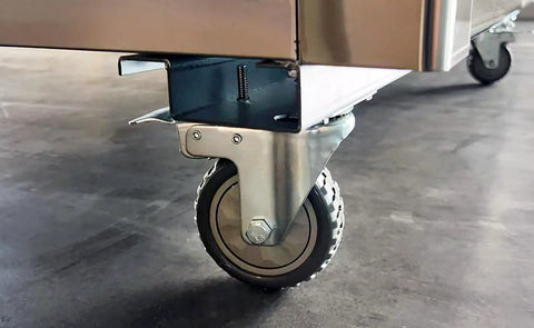 Caster wheel detail of Professional Grade Commercial Stainless Steel Reach In Freezer With Three Roomy Solid Doors and Beefy Cold Storage Setup.