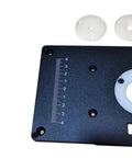 Close-up of Commercial Grade Aluminum Router Table Insert Plate with precision marking and white centering bushings.