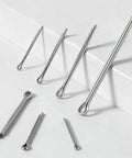 Top-view stainless steel cotter pin assortment (4 sizes) with looped-end pins on a white surface