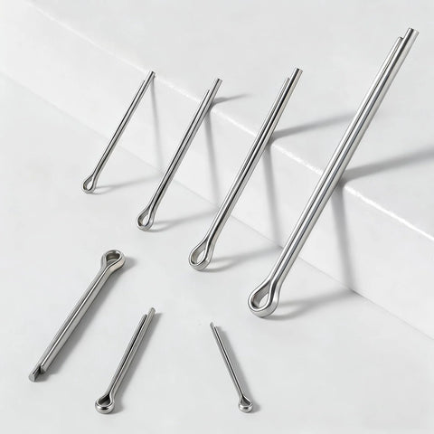 Top-view stainless steel cotter pin assortment (4 sizes) with looped-end pins on a white surface