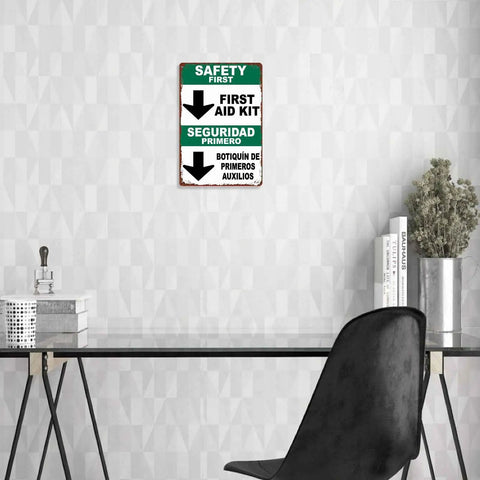 Funny First Aid Kit Metal Sign 8x12 Aluminum Wall Decor in office setting above desk, featuring bilingual safety text.