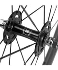 Close-up of hub and spokes in Carbon Clincher Wheelset 700C Fixed Gear Wheels 60/88mm Depth With Basalt Braking Surface V Shape Windbreak