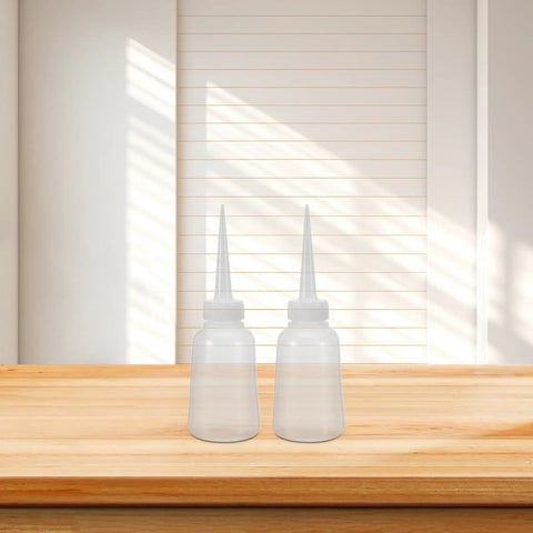 12 Pack Fine Tip Glue Applicator Bottles With Needle Tips For Precise Dispensing In Repairs And Craft Projects, Portable Plastic Squeeze Bottles For Adhesives, Oils, And Paints. Two clear plastic squeeze bottles with needle tips