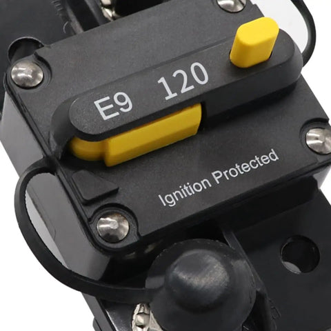 Close-up of Road Ready 120 Amp Circuit Breaker With Manual Reset Switch For Cars And Boats, 48 Volt Overload Protector showing push button and ignition protection.