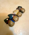 Durable Leather Spur Protectors for Chickens Set of 4 with Flexible Rubber Bands Secure Fit Brown and Black on Floor