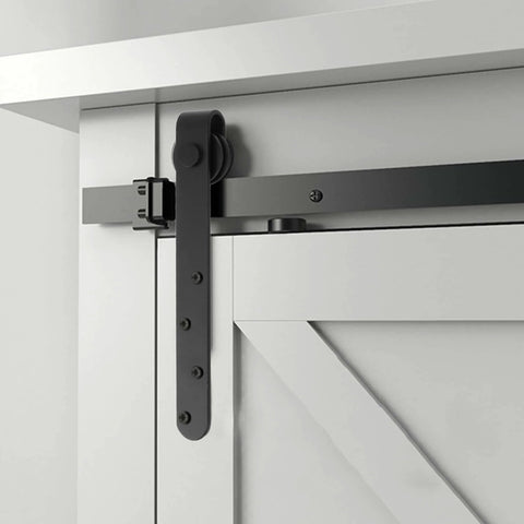 Close-up of Heavy Duty Sliding Barn Door Hardware Kit for Single Or Double Bypass Doors showing steel rail and roller installation.