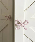 Pink Bow Drawer Pulls And Cabinet Knobs Set, 6 Pack, Solid Metal Handles For Dresser, Vanity, And Kid Friendly Furniture, Adorable Nursery Chic Accent, Easy Swap, Durable And Modern pink bow knob on white cabinet door