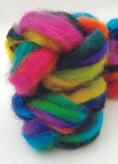 Multicolor wool yarn skein with bright pink, yellow, green, blue, and purple fibers; fuzzy texture.