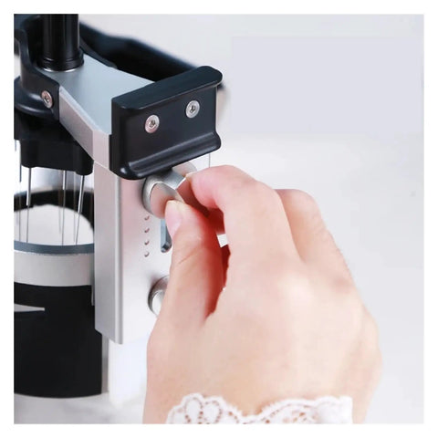 Hand adjusting the knob on Real Talk This Rotating Espresso Coffee Distributor Hits Different With Twelve Precision Needles.