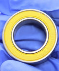 Ceramic Hybrid Radial Bearing 15X26X7Mm 152672RS Stainless Steel for Bicycle Hub in close-up view with yellow seal.