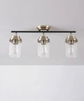 Vintage Vibe Three-Light Track Lighting Bar With Pivoting Heads In Matte Black And Antique Brass Finish, Clear Glass Shades