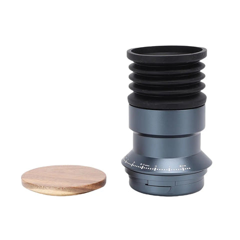 Crush Your Daily Brew Routine With This Straight Fire Manual Coffee Grinder Featuring A Rich Walnut Wood Lid And Nifty Silicone Bellow Blower For Zero Waste Single Dose Grinding At Home, showing gray aluminum body and walnut wood lid.