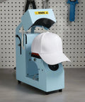MVQJSUCI 2 In 1 Cap Hat Press Machine With Electric Automation Two Platen Choices shown with a white cap in operation.