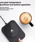 Versatile Electric Cup Warmer With Three Distinct Temperature Levels, sleek black design with hot coffee mug above.