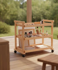 Sturdy Beech Wood Rolling Art Supply Cart With Wide Three Tier Shelves Secure Side Guards And Silky Smooth Wheels for outdoor storage.