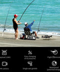 Two anglers setting up a Beast Of A Heavy Lift Fishing Drone With 3 Kg Payload And Bait Release on a sandy beach for sea fishing.