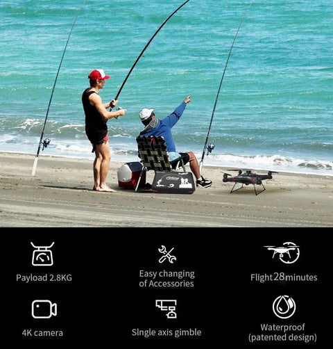 Two anglers setting up a Beast Of A Heavy Lift Fishing Drone With 3 Kg Payload And Bait Release on a sandy beach for sea fishing.