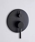 Close-up of Matte Black Wall Mount Bathtub Faucet knob, part of Matte Black Wall Mount Bathtub Faucet With Hand Shower, High Flow Waterfall Spout, Solid Brass Construction, 1/2 Inch NPT Standard Plumbing, Quick Bath Fill For Your Go-To Modern Spa Upgrade