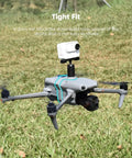 All In One Drone Action Camera Mount For Mavic Air 3S And Air 3 with Osmo Action attached, shown flying over grass.