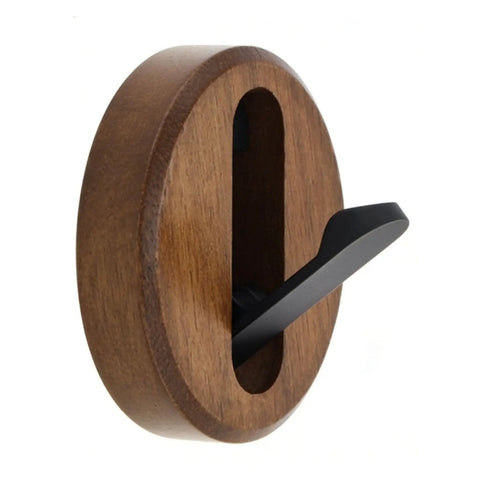 Swanky Black Walnut Wall Mounted Hooks For Folding Storage Game Changer For Small Spaces Modern Wood Coat Hanger in brown with black hook.