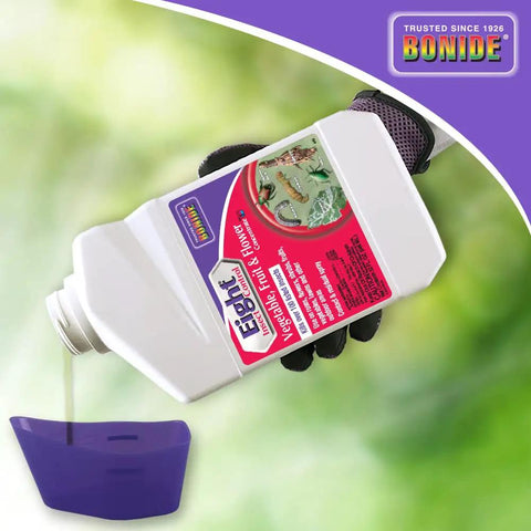 Eight Insect Control For Vegetables Fruits And Flowers 32 Oz Concentrate bottle pouring into garden sprayer