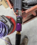 Close-up of One Quarter Inch Polyurethane Air Hose Reinforced Lightweight Compressor Tubing with purple connector fittings.
