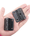 Set Of Four Sweet Vintage Half Surface Hinges For Cabinets And Doors Heavy Duty Rust Proof Steel Hardware With Silky Smooth Action Fast Easy Diy Mounting For Furniture Builds, matte black, held in hand.