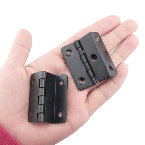 Set Of Four Sweet Vintage Half Surface Hinges For Cabinets And Doors Heavy Duty Rust Proof Steel Hardware With Silky Smooth Action Fast Easy Diy Mounting For Furniture Builds, matte black, held in hand.