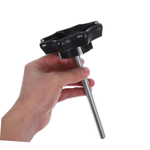 Hand holding a Spare Tire Hold-Down Bolt Kit For Cars - Universal Fit Wheel Clamp with metal bolt and black plastic knob top.