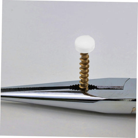 Close-up of white plastic screw cover cap with metal screw for furniture, part of the Plastic Screw Cover Caps Set 400 Pieces Hinged Design