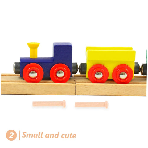 20 Piece Miniature Solid Wood Nails For Crafting And Woodworking T Shaped Round Pegs in front of wooden toy train on tracks