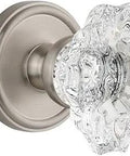 Georgetown Retro Rosette With Biarritz Knob Double Dummy Satin Nickel Door Hardware Set For Standard Doors One And Three Eighths To One And Three Quarters Inches With Two And Three Eighths Backset Easy Install On Modern Pre Drilled Doors close-up of crystal knob and rosette.